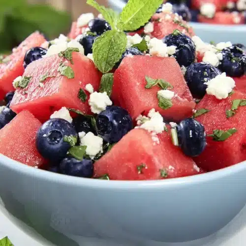 Watermelon Feta Blueberry Salad 4 Watermelon feta blueberry salad with mint in a ceramic bowl