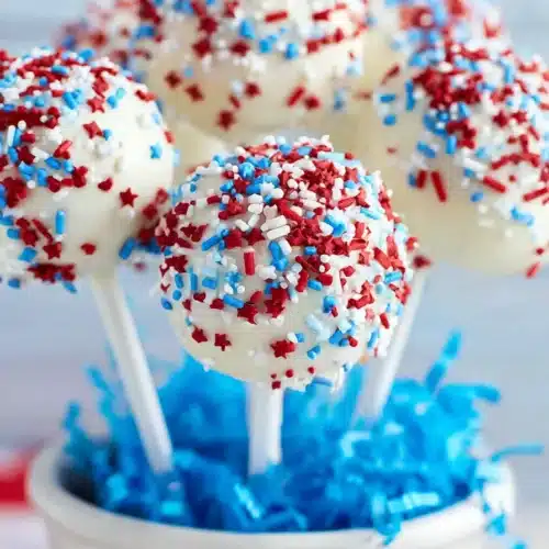 4th of July cake pops with white chocolate coating and red white blue sprinkles