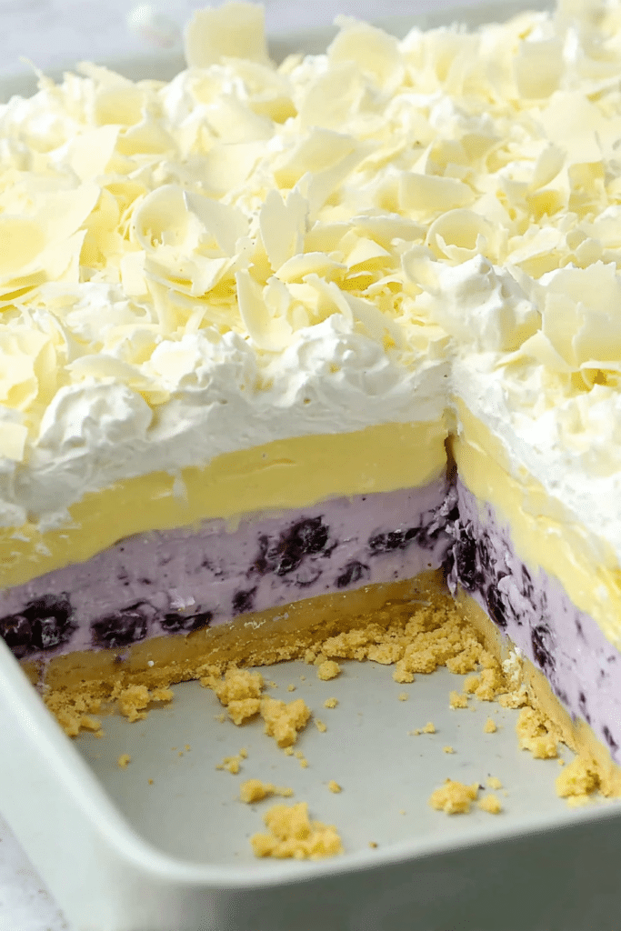 Lemon Blueberry Lasagna sliced to show creamy layered dessert filling
