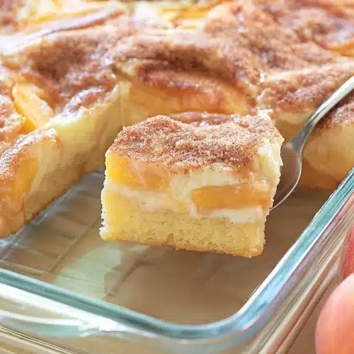 Peaches and Cream Pie slice showing creamy layers and juicy peaches