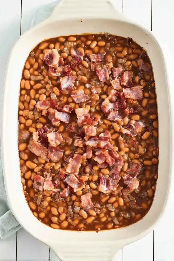 BBQ Baked Beans 3 BBQ Baked Beans in baking dish topped with crispy bacon