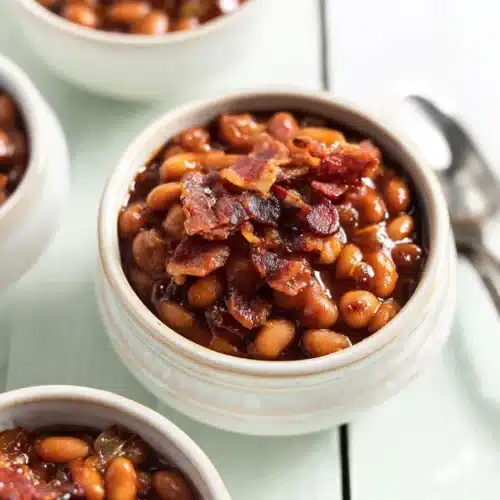BBQ Baked Beans 5 BBQ baked beans with crispy bacon in stoneware bowls