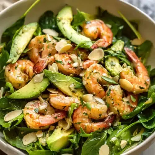 Citrus Shrimp and Avocado Salad 5 Citrus shrimp and avocado salad with fresh greens, almonds, and creamy avocado