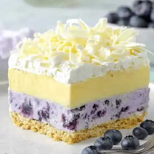 Lemon Blueberry Lasagna Golden Oreo crust pressed into baking dish