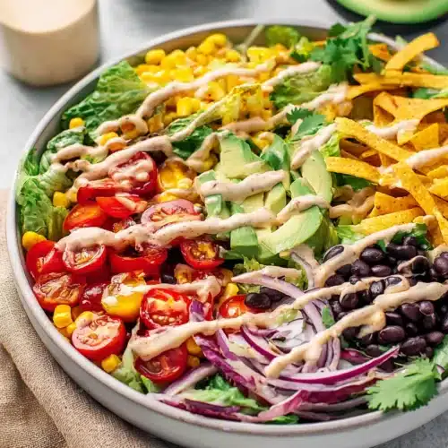 Southwest Salad Recipe 6 Southwest Salad with avocado, black beans, corn, tomatoes, and chipotle ranch