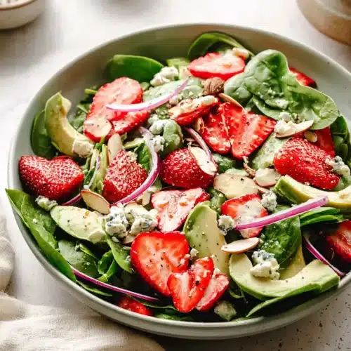 Strawberry Avocado Spinach Salad 4 Strawberry Avocado Spinach Salad with almonds, cheese, and poppyseed dressing