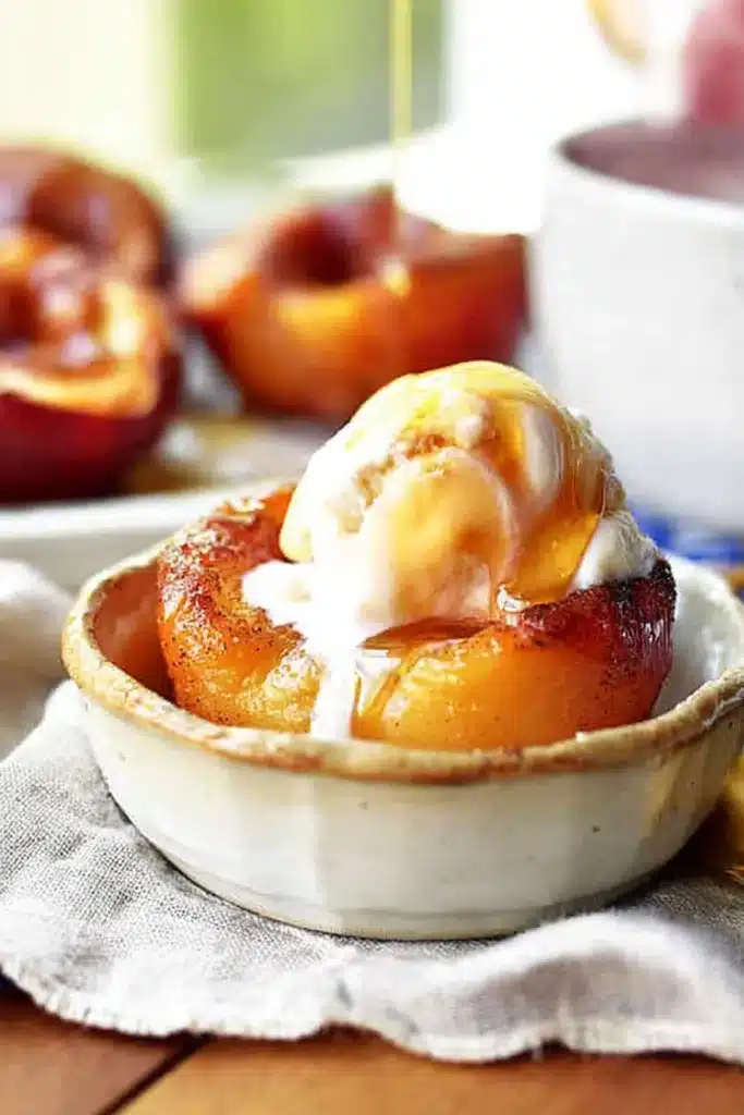 Cinnamon sugar baked peaches with vanilla ice cream and caramel drizzle