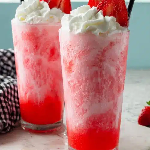 Coffee Creamer And Soda 4 Strawberry coffee creamer and soda drink with whipped cream in tall glasses