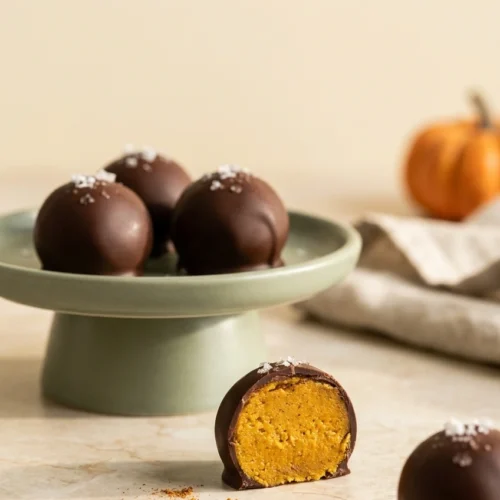 Healthy Pumpkin Truffles: Easy No-Bake Pumpkin Treats 3 Healthy Pumpkin Truffles with dark chocolate coating and soft pumpkin spice filling